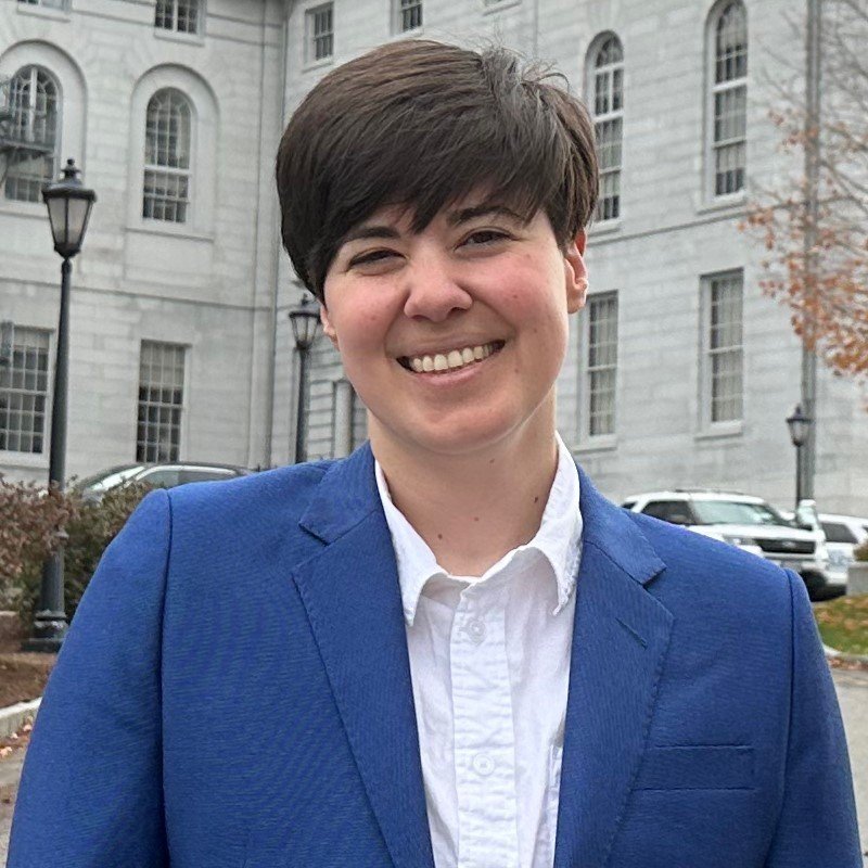 Anna Kellar stands in front of the Maine State House