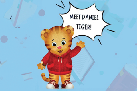 Daniel Tiger wears a read sweatshirt on a blue background. He is waving and a speech bubble says, "meet Daniel Tiger!"