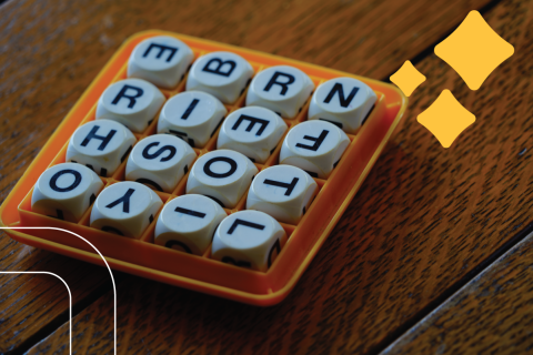 a boggle set on a kitchen table