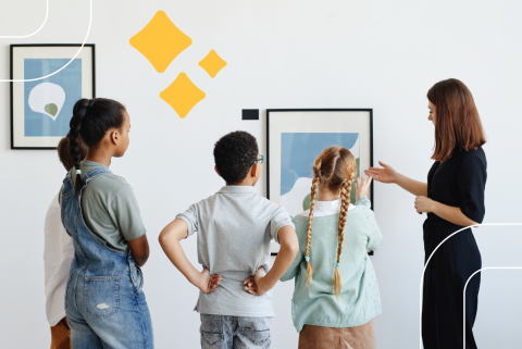 a teacher shows artwork in a gallery to four kids aged 8–12