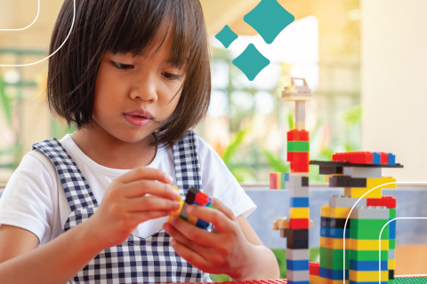 kid plays with legos