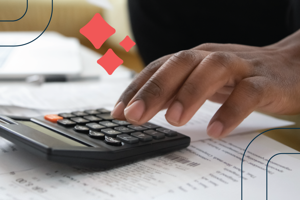 a hand enters information into a calculator