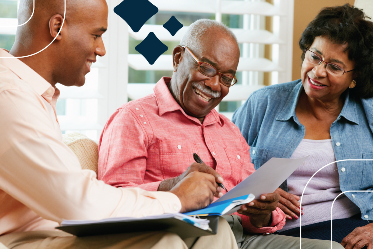 a volunteer helps an older adult sign up for benefits