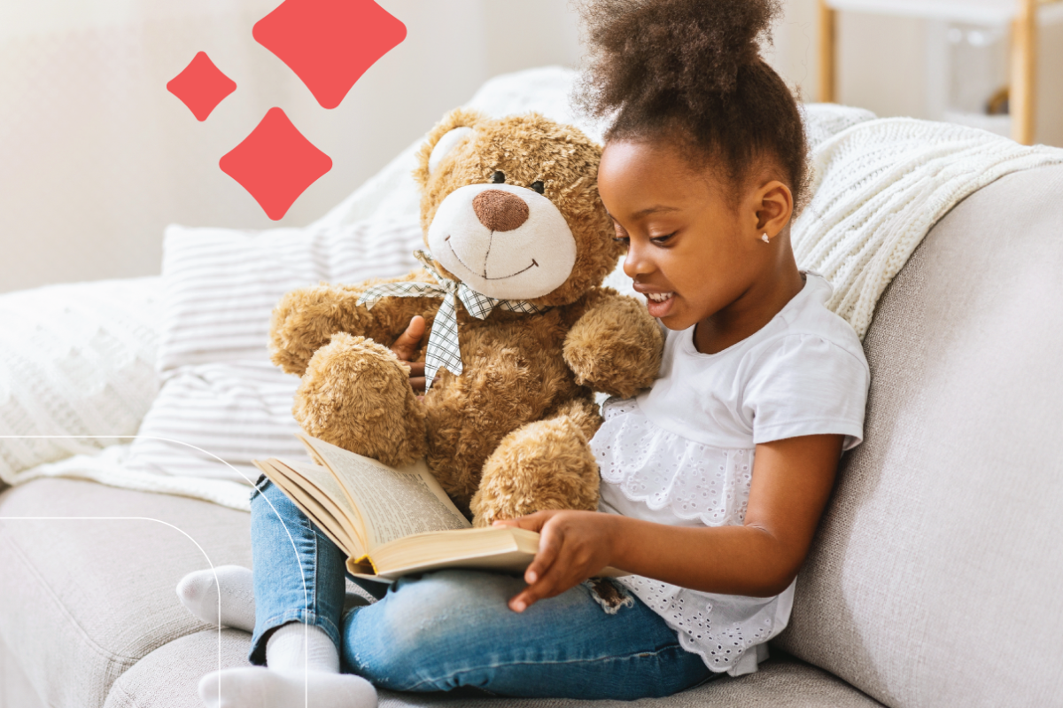 girl reads a story to her stuffed animal