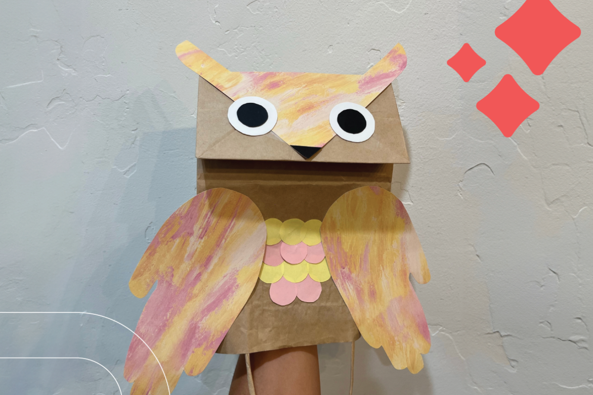 an owl puppet made from a paper bag